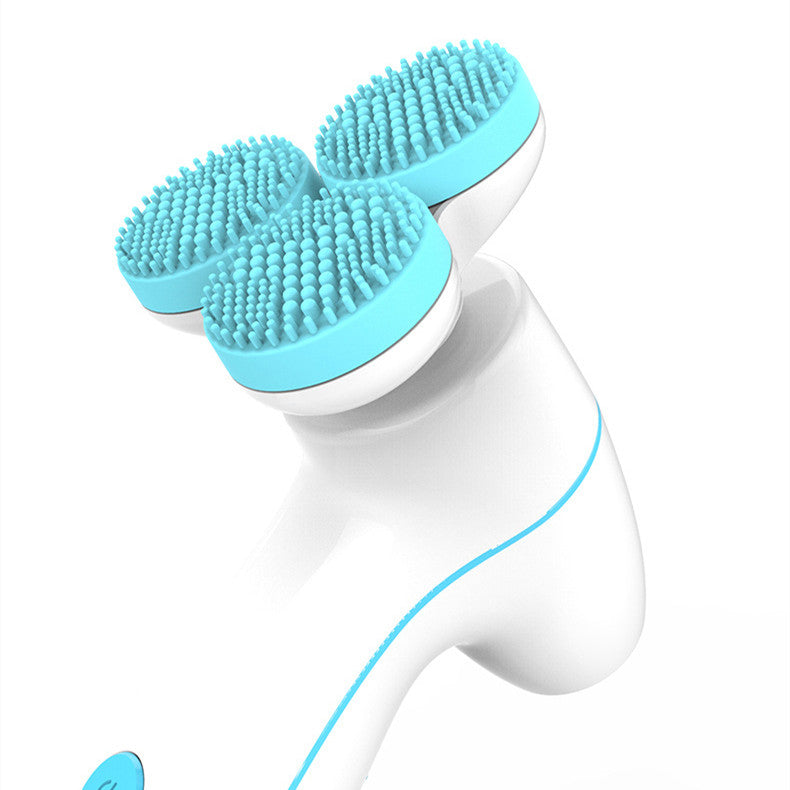 Close-up of the DeepGlow™ 3D facial cleansing brush with three soft silicone bristle heads.